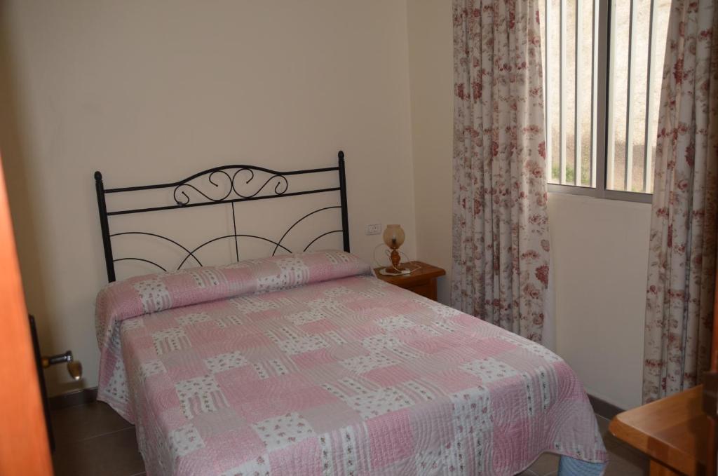 Postel nebo postele na pokoji v ubytování Casa Camilo