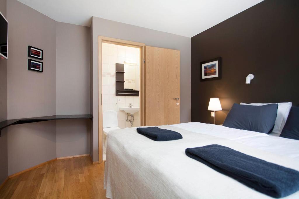 Postel nebo postele na pokoji v ubytování Torg Guest House
