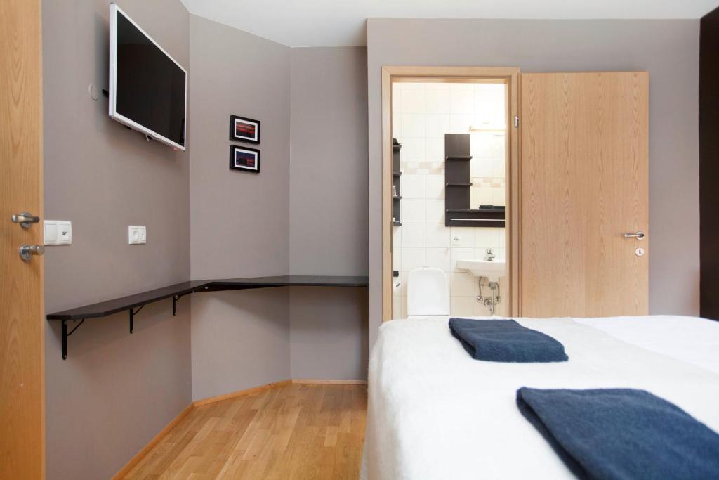Postel nebo postele na pokoji v ubytování Torg Guest House