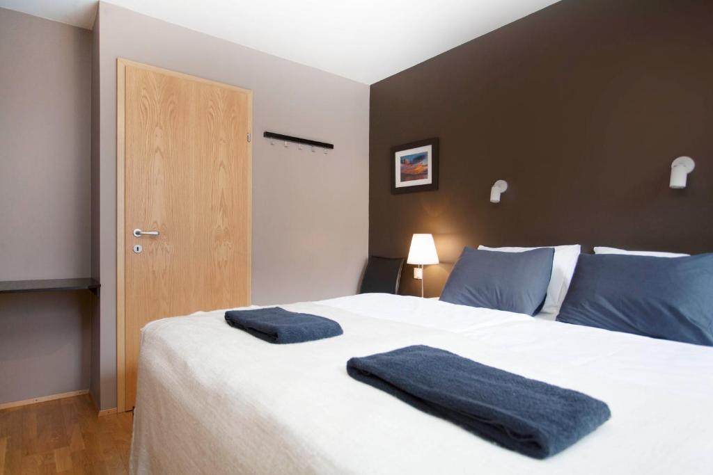 Postel nebo postele na pokoji v ubytování Torg Guest House