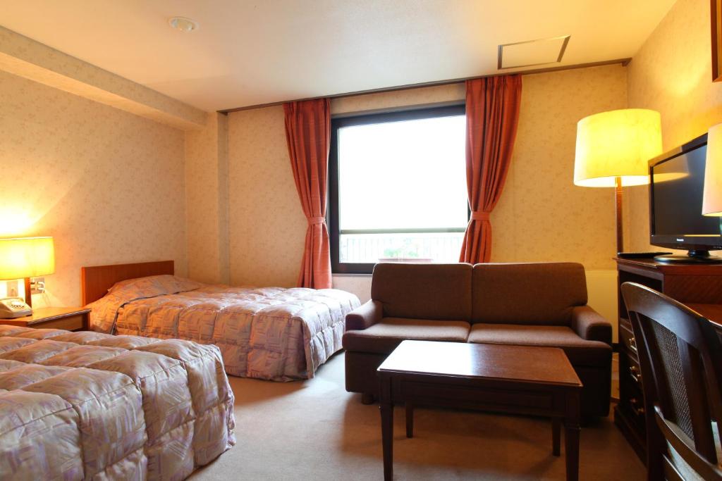 Postel nebo postele na pokoji v ubytování Shiga Kogen Hotel Shiga Sunvalley