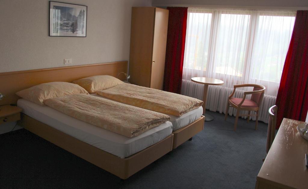 Voodi või voodid majutusasutuse Hotel Eigerblick toas