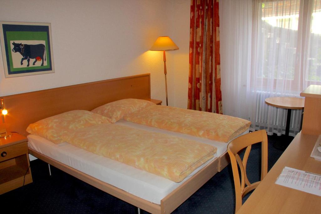 Voodi või voodid majutusasutuse Hotel Eigerblick toas