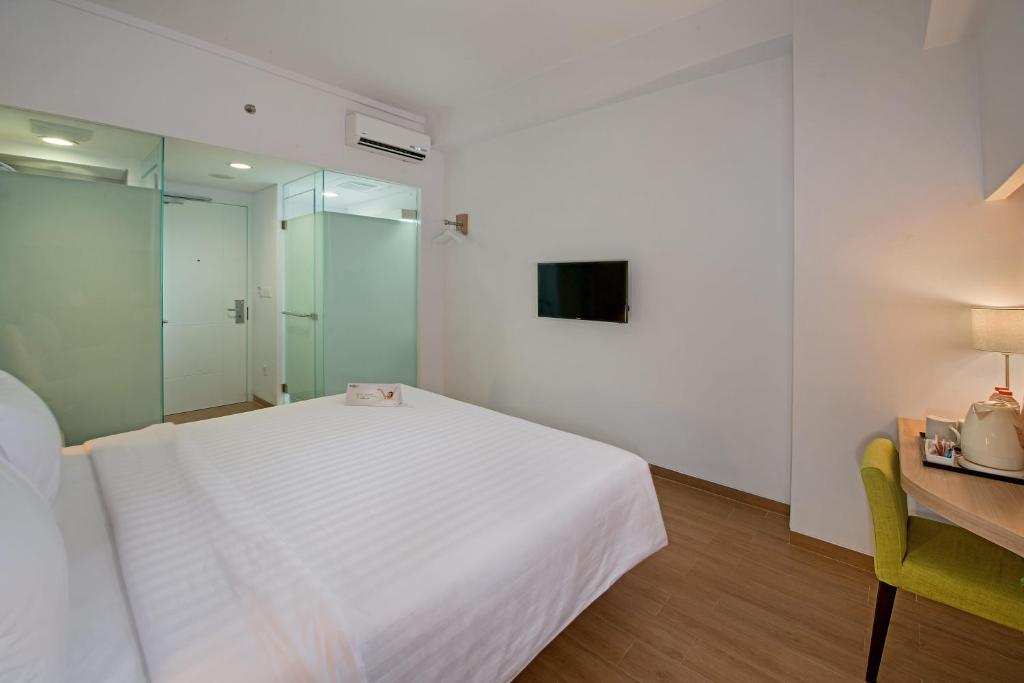 TV a/nebo společenská místnost v ubytování Whiz Prime Hotel Pajajaran Bogor