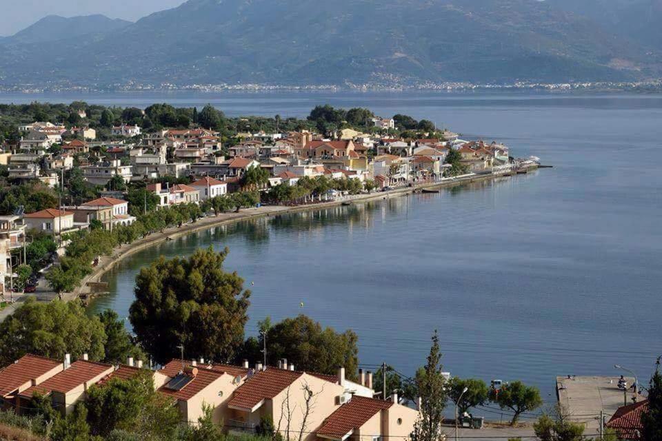 a town on the shore of a large body of water at Panormos Serene Nests - Gateways to Achaia in Psathopirgos
