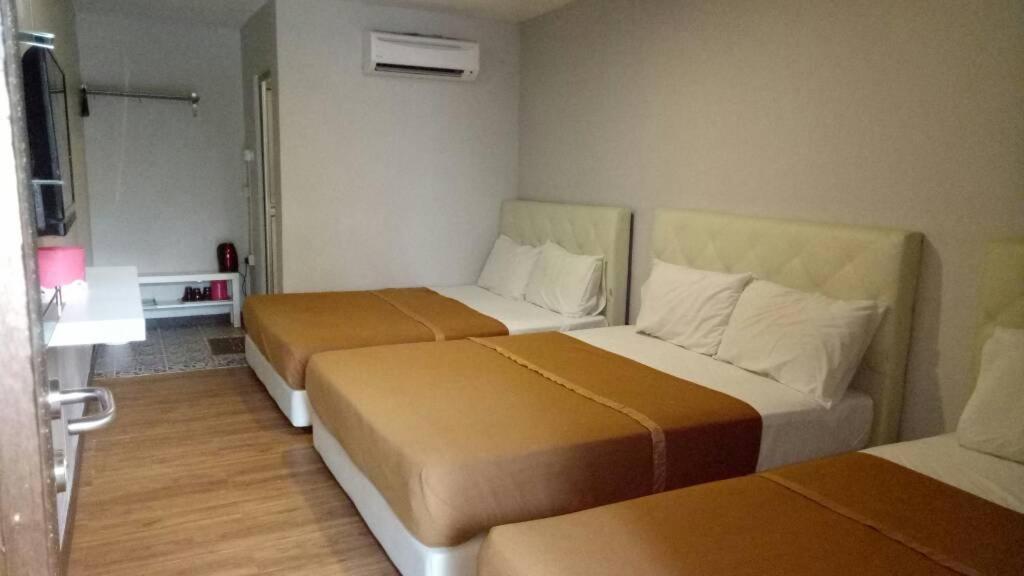 Tempat tidur dalam kamar di Selesa View Gambang