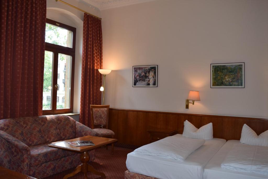 Postel nebo postele na pokoji v ubytování Hotel Artushof