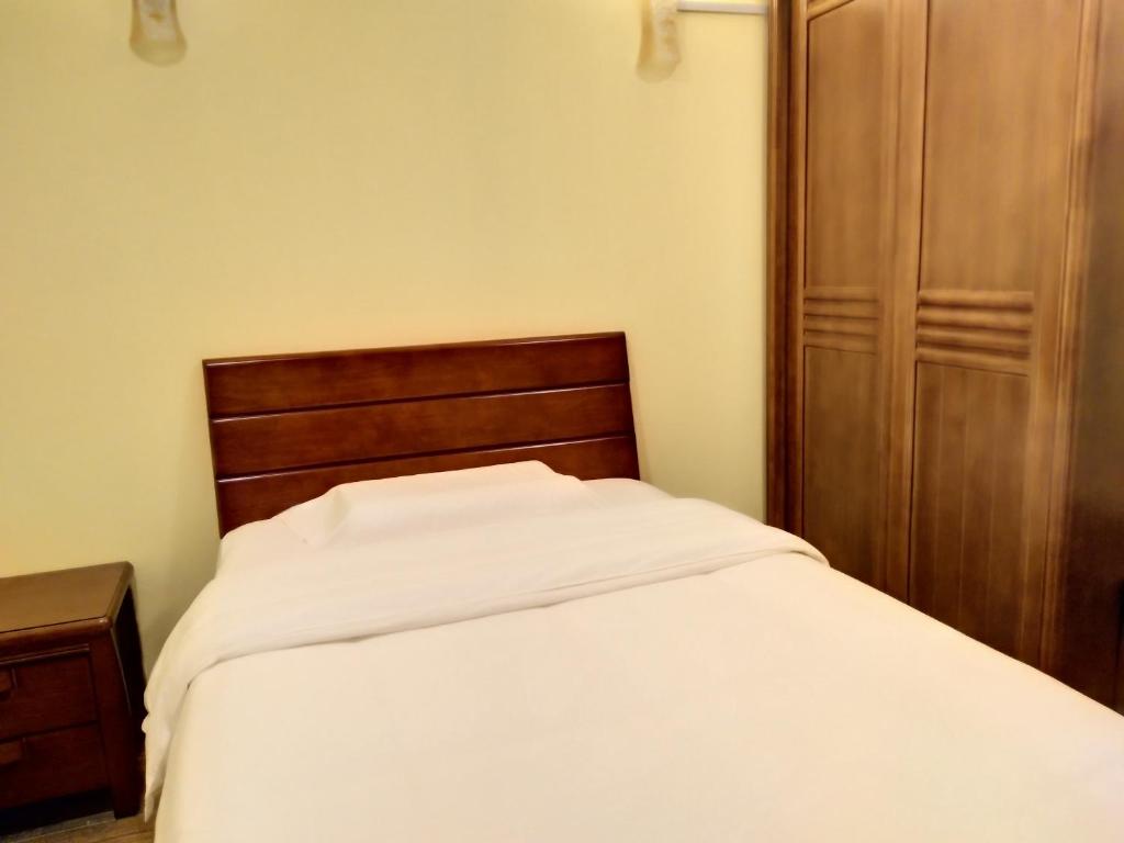 Postel nebo postele na pokoji v ubytování Uncle Ho Motel