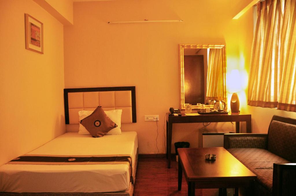 Postel nebo postele na pokoji v ubytování Astoria Hotel