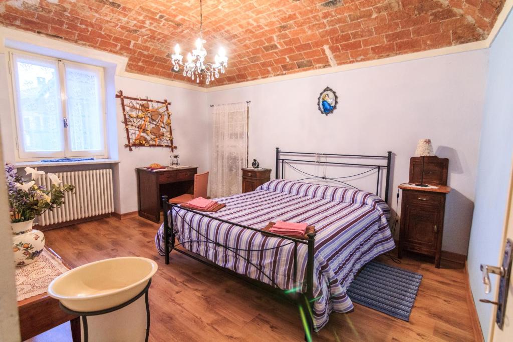 Postel nebo postele na pokoji v ubytování I Quattro Gatti