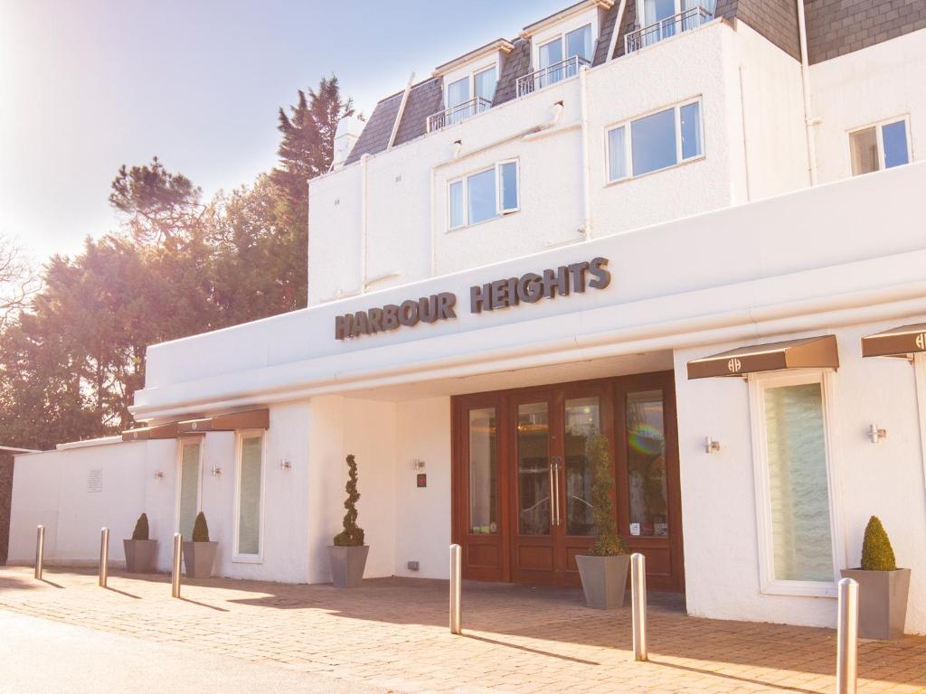 a building with a sign that reads hampton heights at Harbour Heights Hotel in Poole