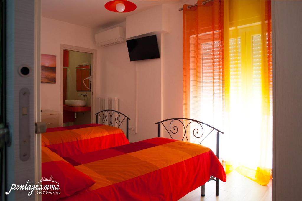 A bed or beds in a room at Il Pentagramma