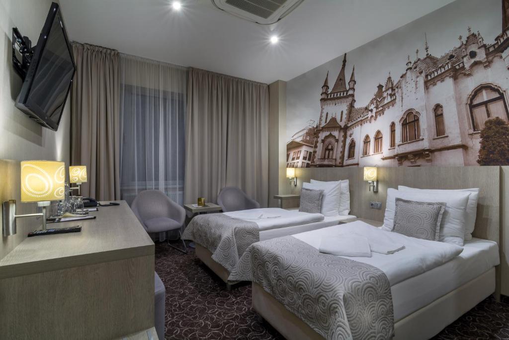 Postel nebo postele na pokoji v ubytování Košice Hotel