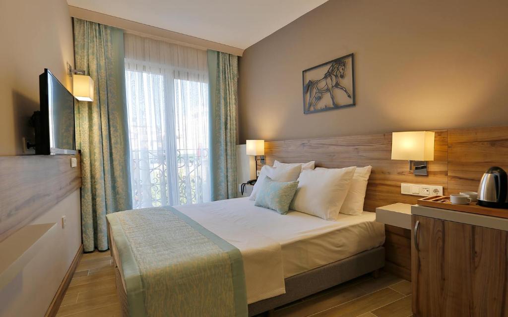 Postel nebo postele na pokoji v ubytování Kule Hotel