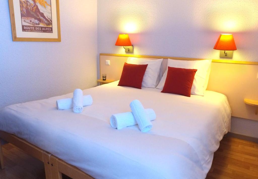 מיטה או מיטות בחדר ב-VVF Les 7 Laux Massif de Belledonne