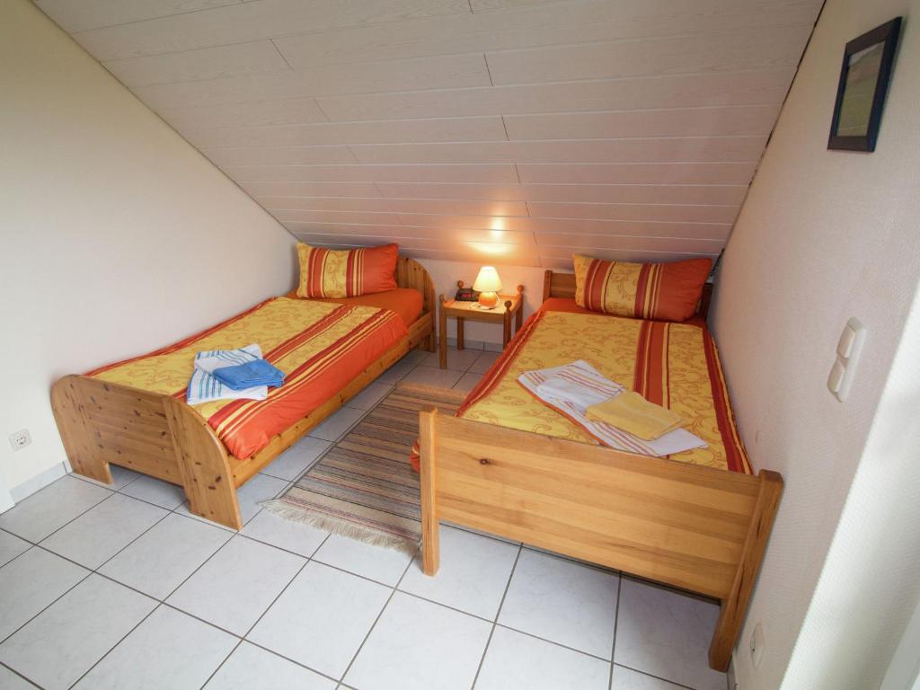 Postel nebo postele na pokoji v ubytování Holiday Home in Buchenberg near Forest