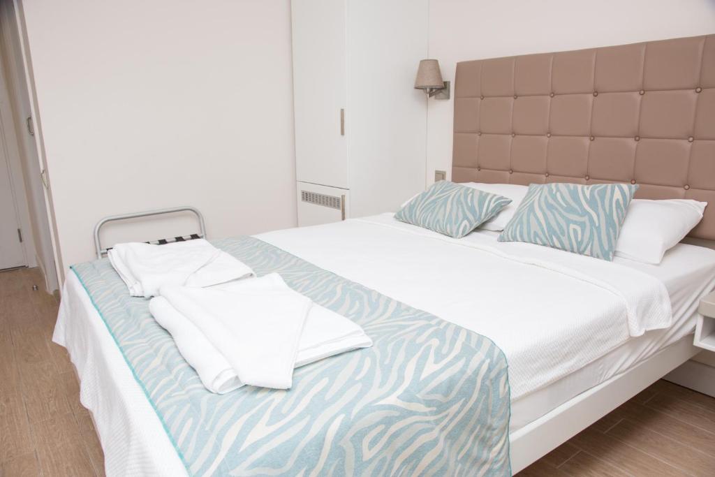 Кровать или кровати в номере Asli Hotel