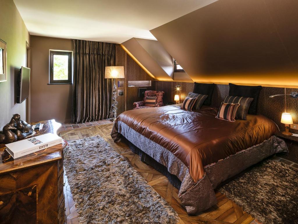 Postel nebo postele na pokoji v ubytování Hotel des Berges, Restaurant Gastronomique & Spa