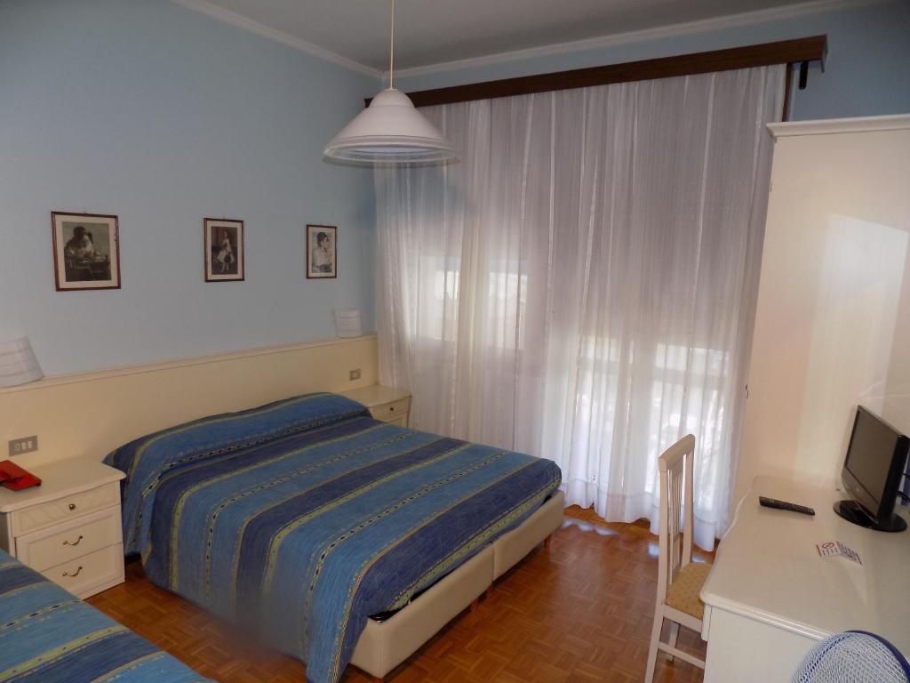 Postel nebo postele na pokoji v ubytování Hotel Udinese da Aldo