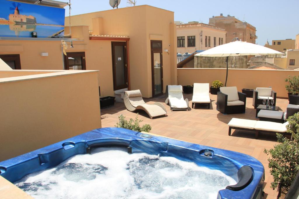 a hot tub on the roof of a house at Appartamenti Trapani In in Trapani