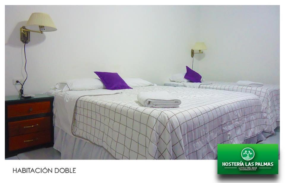 Postel nebo postele na pokoji v ubytování Hotel Las Palmas