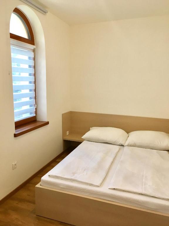 Postel nebo postele na pokoji v ubytování Apartman Diófa
