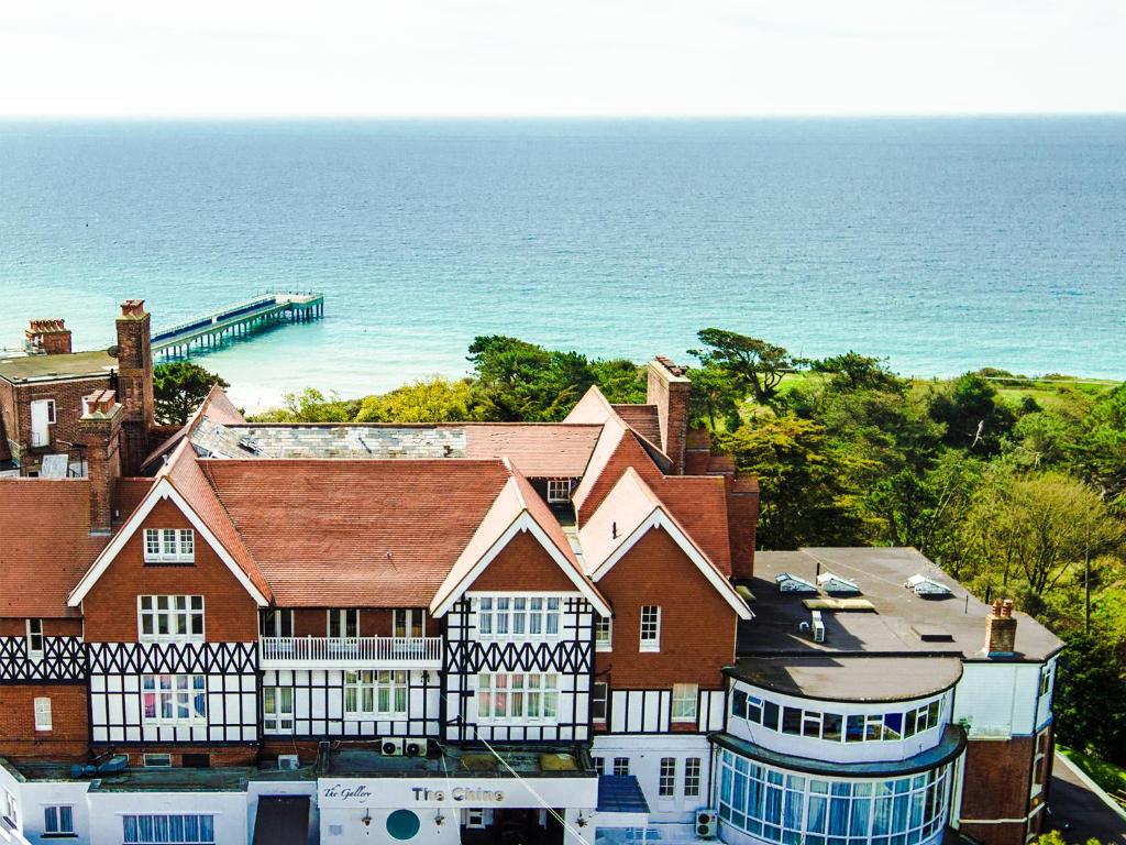 a large building with a view of the ocean at Chine Hotel in Bournemouth