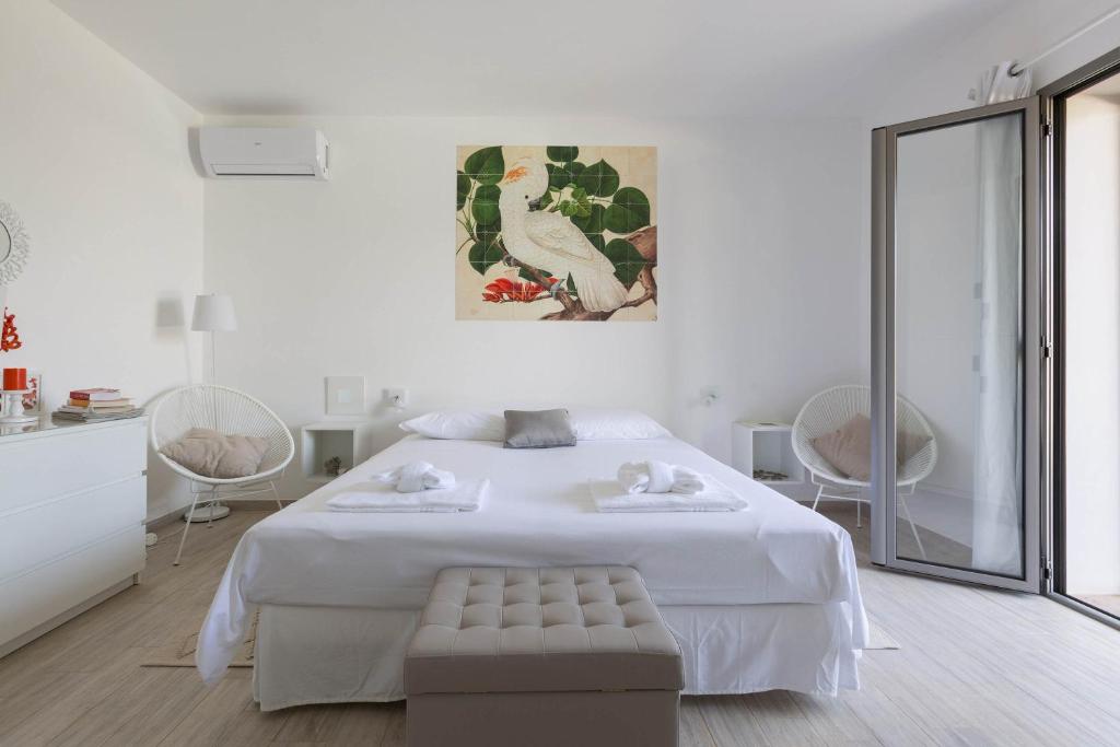 Łóżko lub łóżka w pokoju w obiekcie Villa Sogno Bianco by BarbarHouse