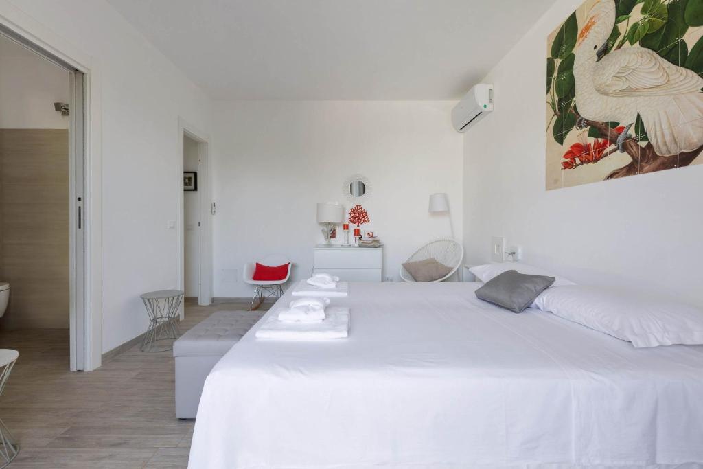 Łóżko lub łóżka w pokoju w obiekcie Villa Sogno Bianco by BarbarHouse