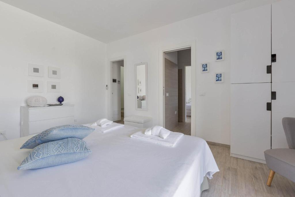 Łóżko lub łóżka w pokoju w obiekcie Villa Sogno Bianco by BarbarHouse