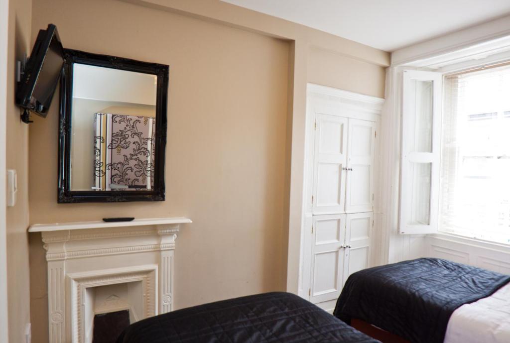 Postel nebo postele na pokoji v ubytování 7 Boutique Hotel