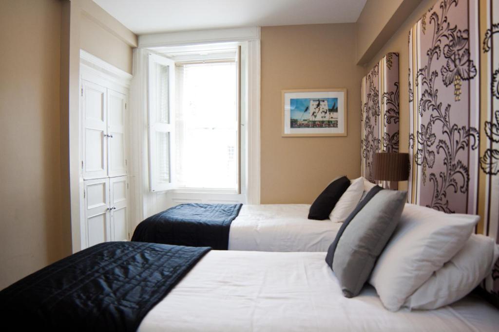 Postel nebo postele na pokoji v ubytování 7 Boutique Hotel