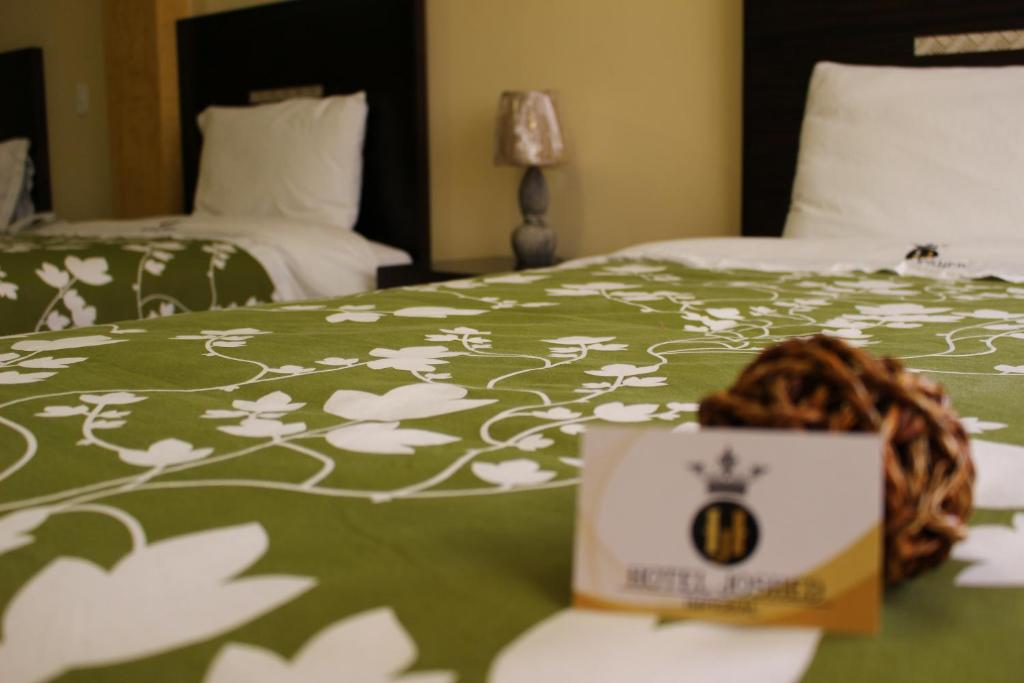 Postel nebo postele na pokoji v ubytování Hotel Joshed Imperial