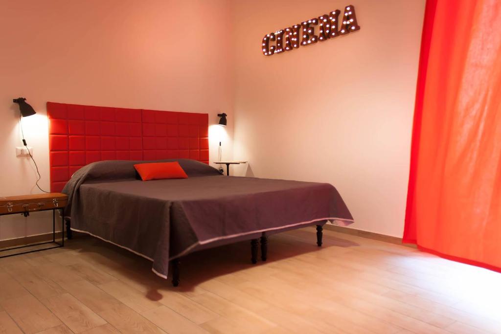 Postel nebo postele na pokoji v ubytování Napoli Boulevard B&B