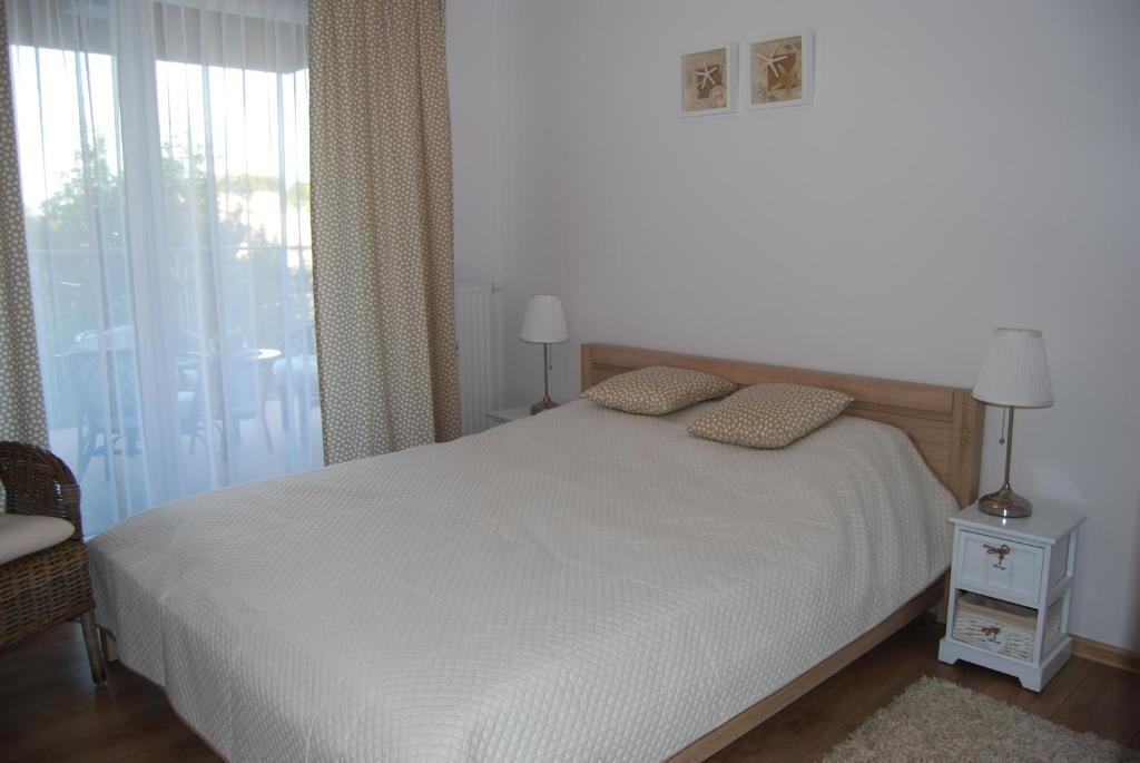 Posteľ alebo postele v izbe v ubytovaní Apartament Piaskowy Polanki Park