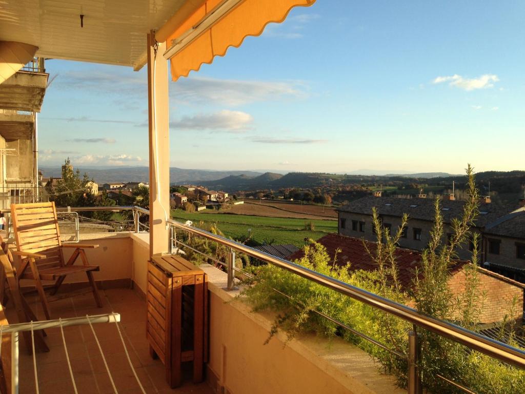 a balcony with a view of the countryside at La Quiniela in Aviá