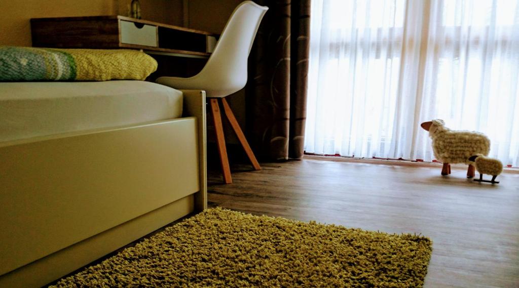 Postel nebo postele na pokoji v ubytování Schneiderlein Hotel