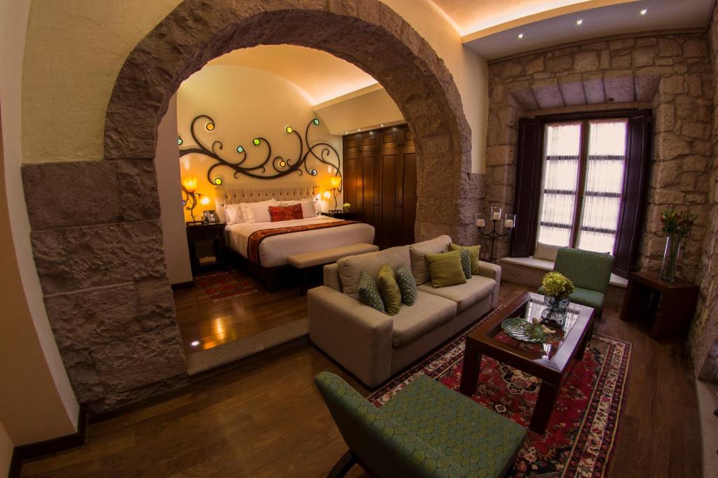Postel nebo postele na pokoji v ubytování Hotel De La Soledad
