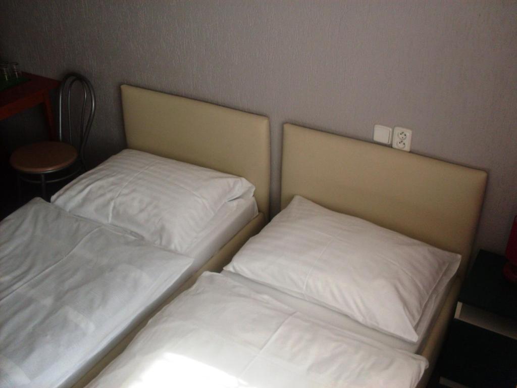 Ένα ή περισσότερα κρεβάτια σε δωμάτιο στο Promohotel Slavie