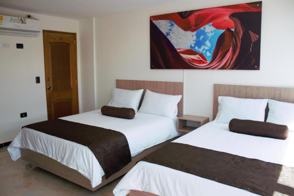 Postel nebo postele na pokoji v ubytování Hotel Med Estadio
