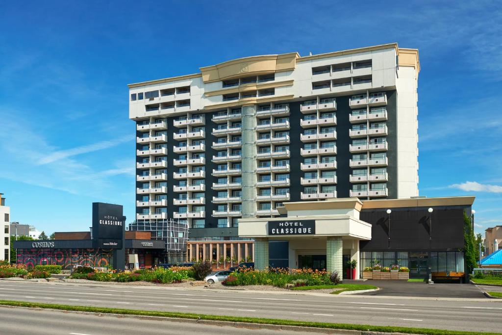 a large building in front of a street at Hotel Classique in Quebec City