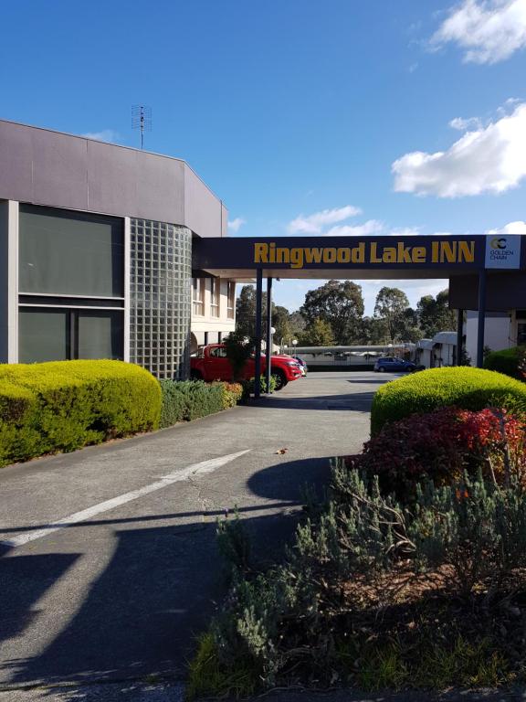a building with a sign that reads kingswood lake inn at Ringwood Lake Inn in Ringwood