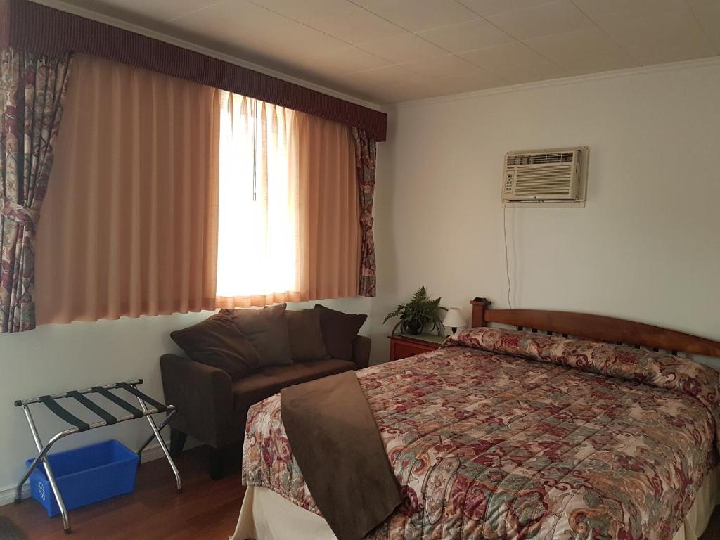 Postel nebo postele na pokoji v ubytování Flamingo Motel