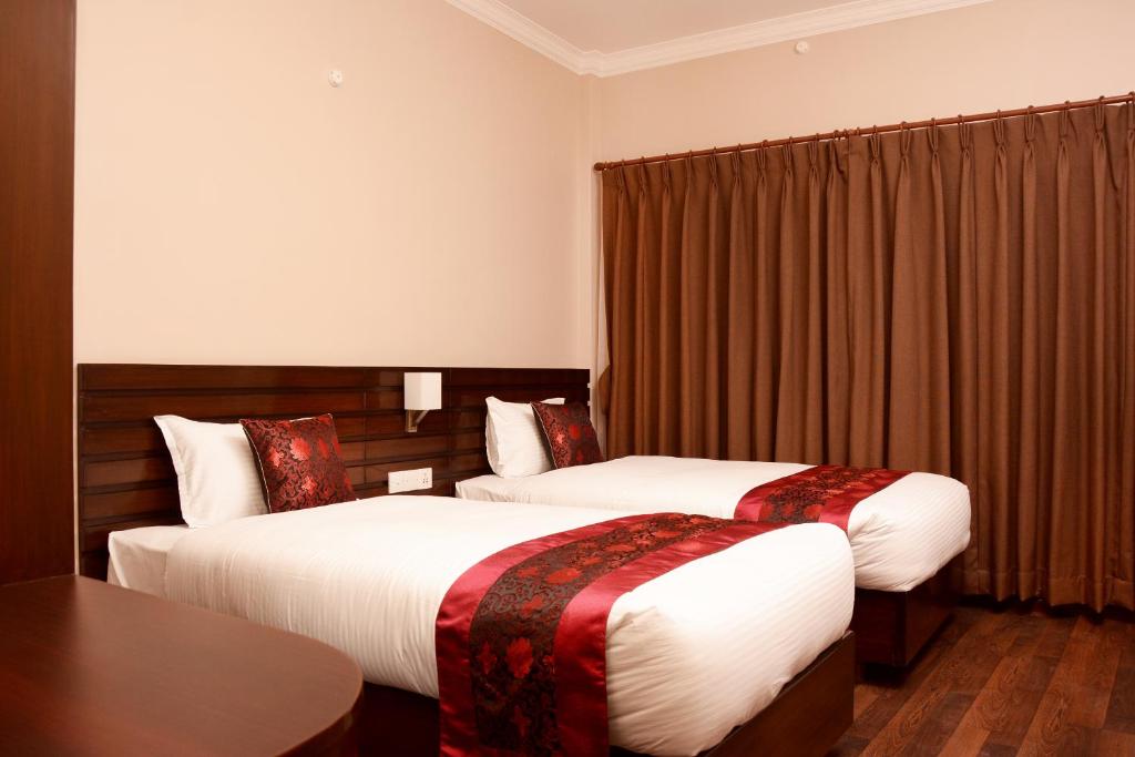 Postel nebo postele na pokoji v ubytování Hotel Mudita