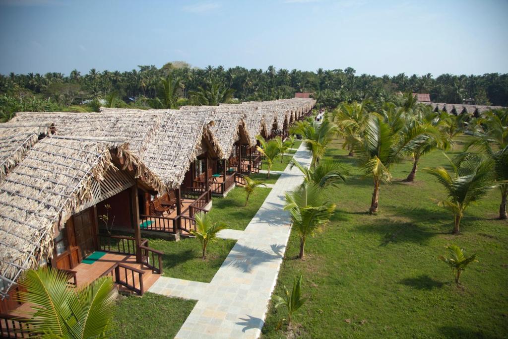 an aerial view of a resort with palm trees at Symphony Palms Beach Resort And Spa in Havelock Island