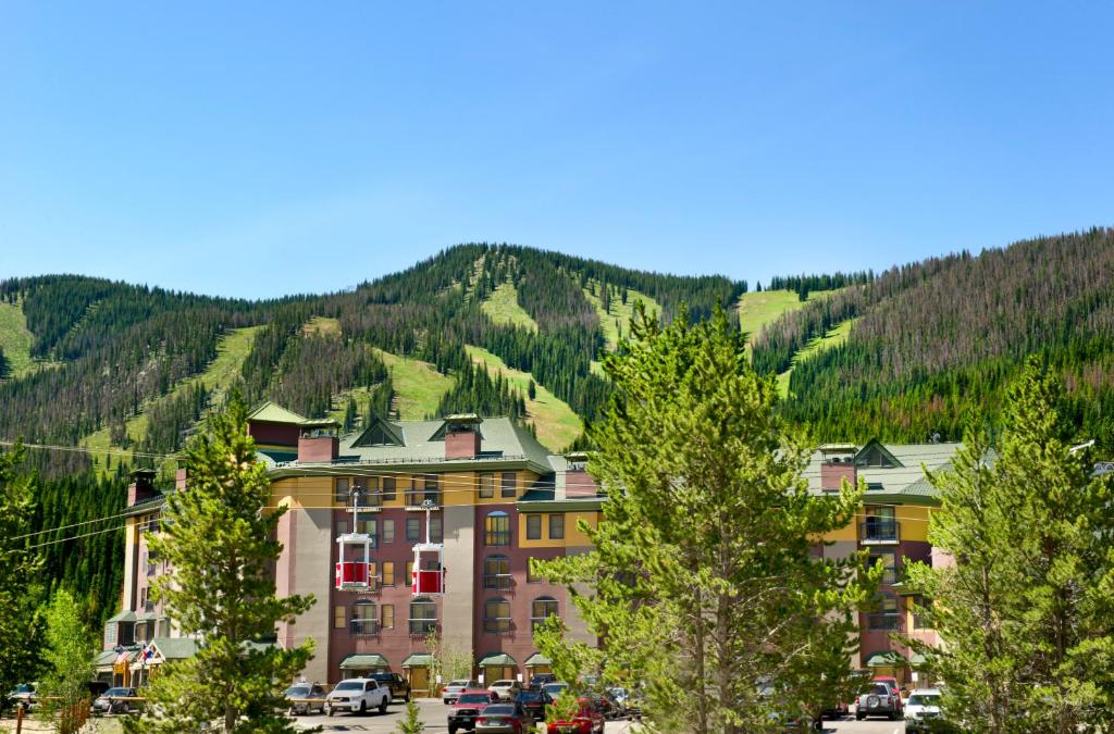 a large building with a mountain in the background at The Vintage Hotel in Winter Park