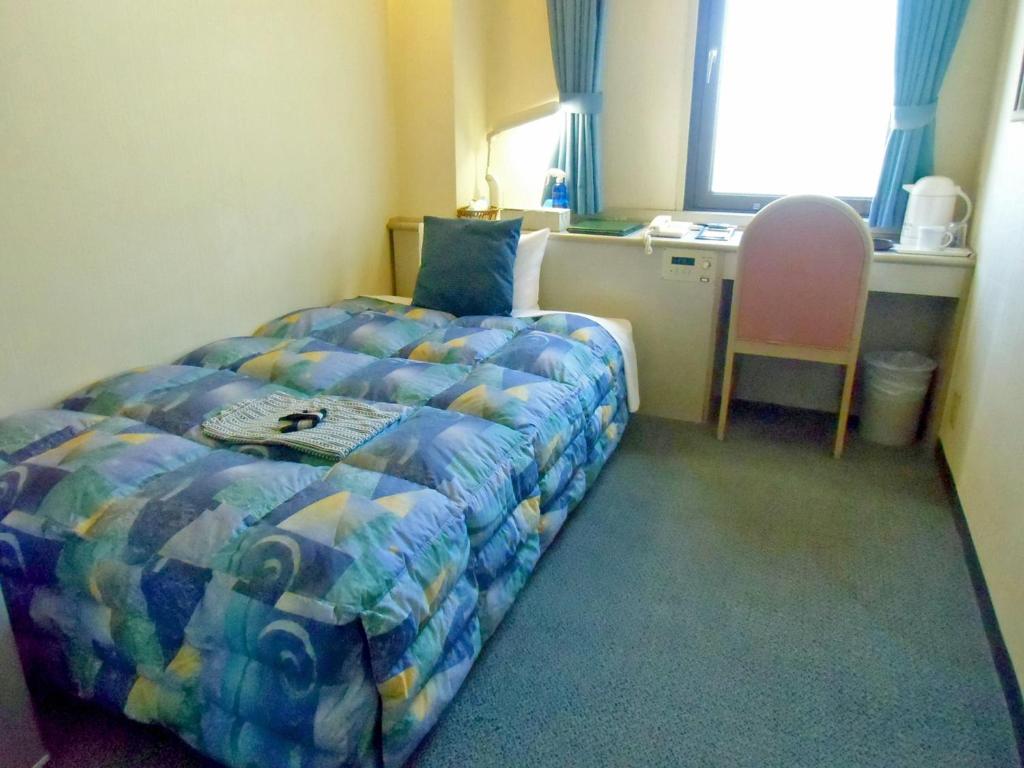 Postel nebo postele na pokoji v ubytování Hotel A.P
