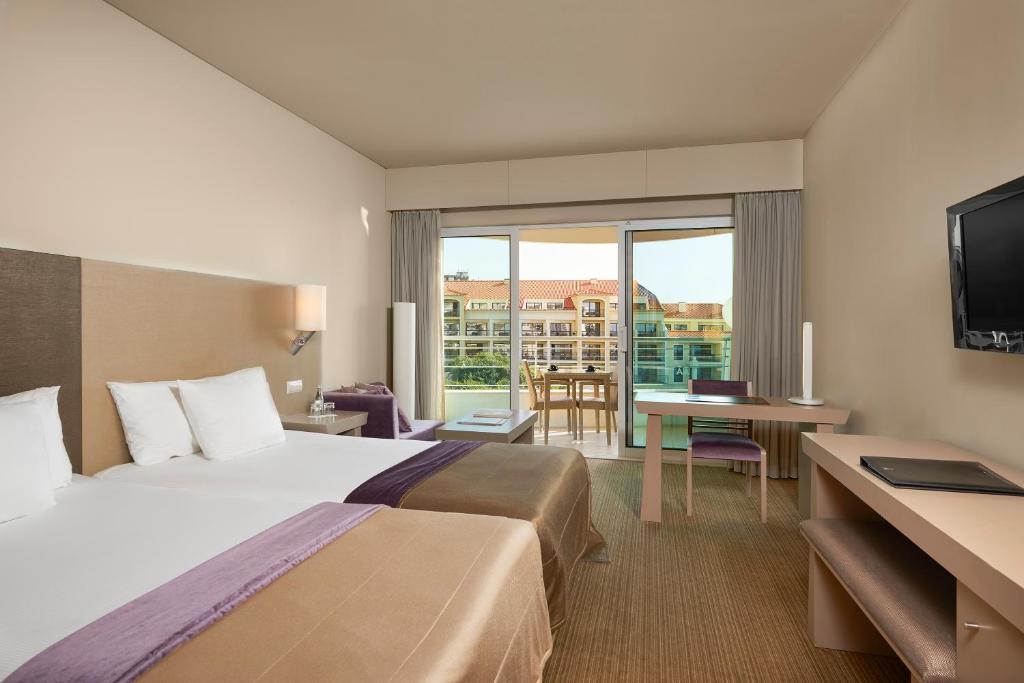 TV a/nebo společenská místnost v ubytování Melia Madeira Mare