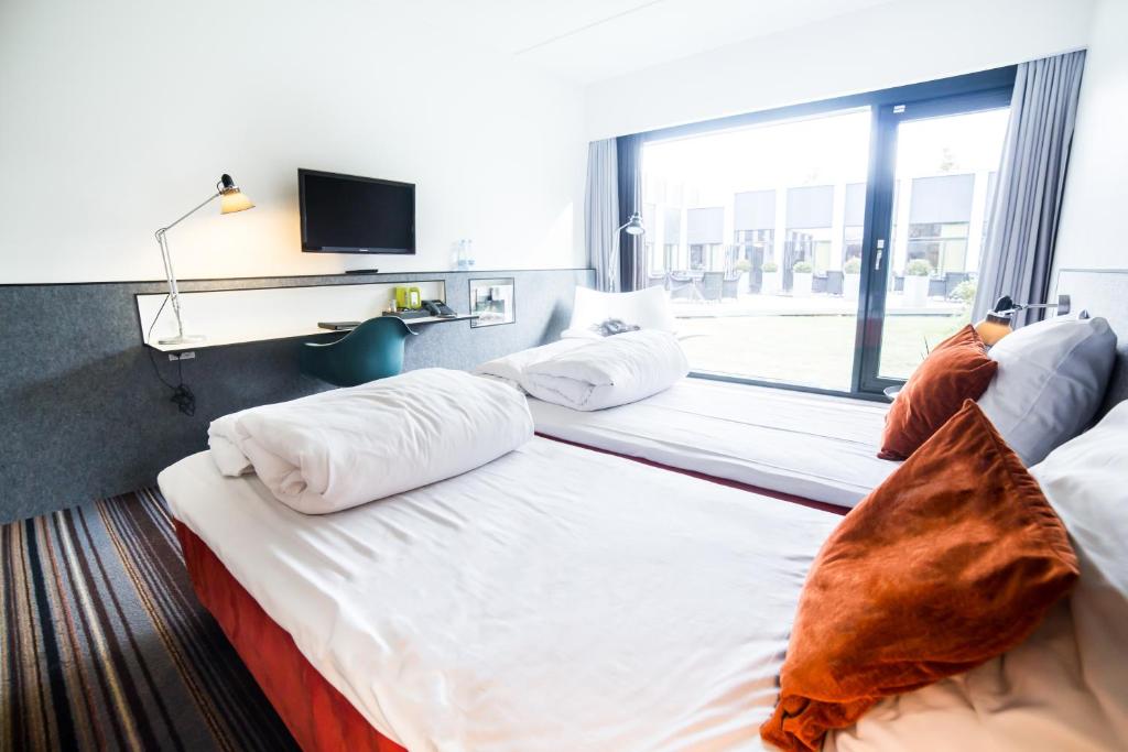 Postel nebo postele na pokoji v ubytování Comwell Roskilde