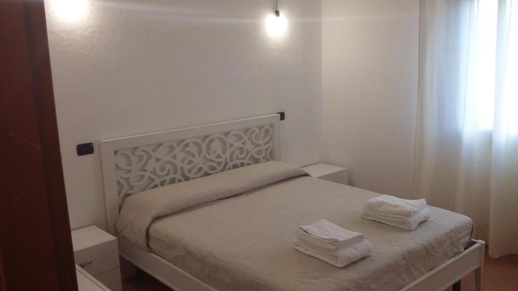 Posteľ alebo postele v izbe v ubytovaní Don Diego Apartment Orosei